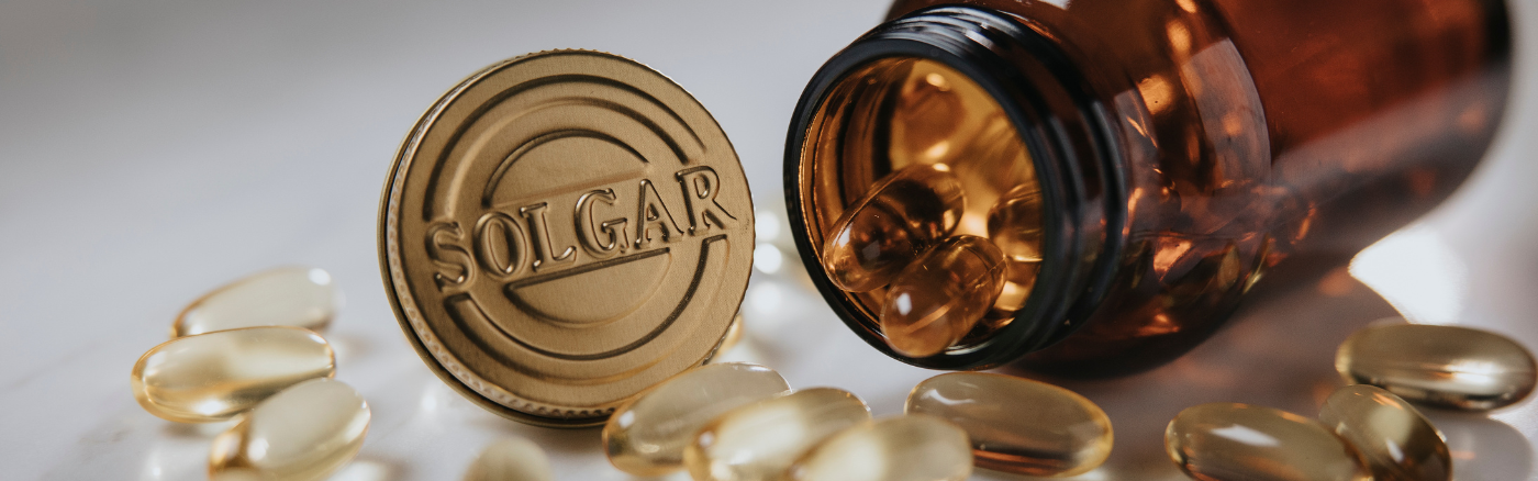 About us mission - an open tablets capsule and its lid featuring the Solgar brand.