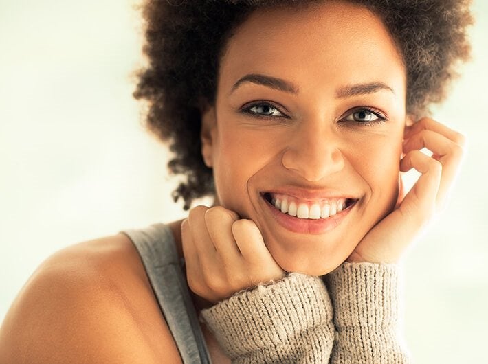 A healthy woman smiling - Brain Health.