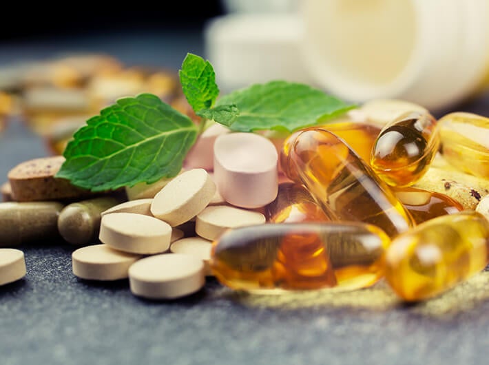 Speciality - Different tablets spread out on a table.